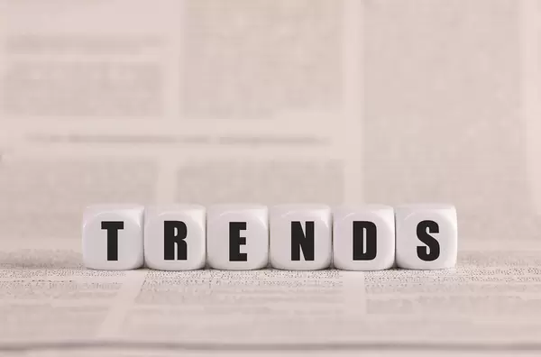 Trends written with cubes on a newspaper