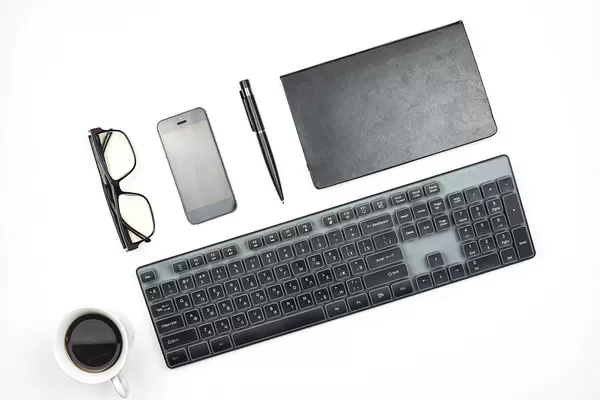 Trendy arrangement of black office supplies on white background