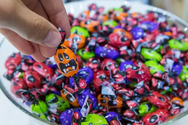 Trick or treat? A plate of funny, multicolored Halloween sweets