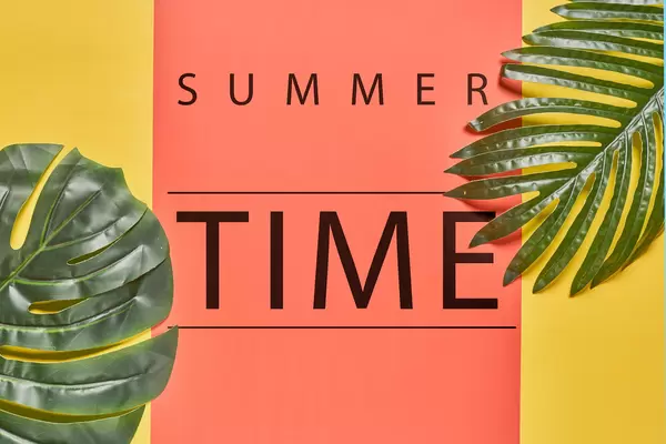 Tropical bright colorful summer background with tropical palm leaves