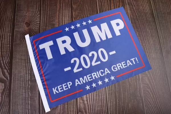 Trump 2020 flag on wooden background