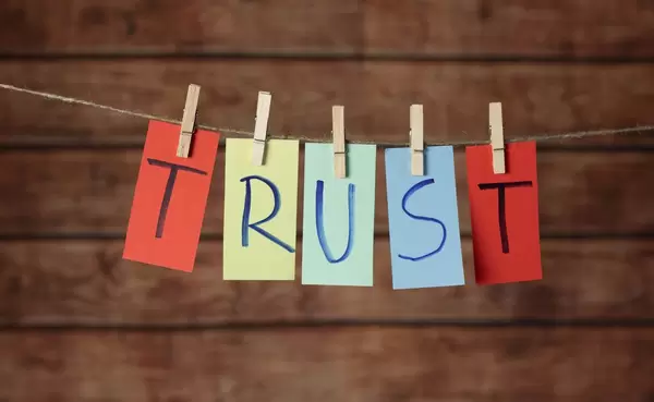 Trust text hanging on the rope
