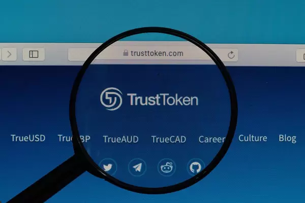 TrustToken logo under magnifying glass