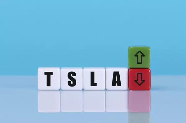 TSLA text on cubes with up and down arrow