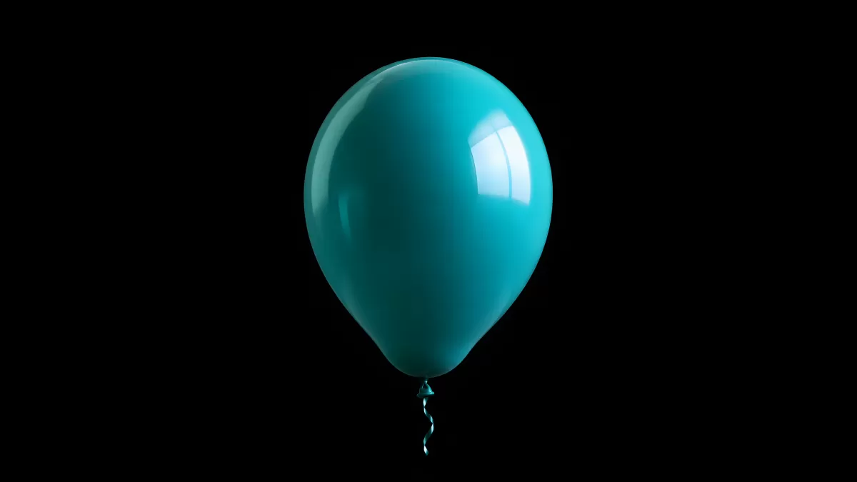Türkisfarbener Luftballon vor schwarzem Hintergrund