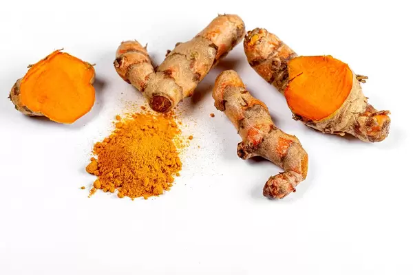 Turmeric and turmeric powder on white background