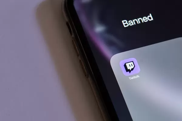Twitch app logo in Banned folder on phone screen