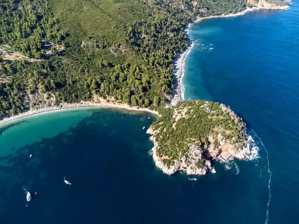 Two beaches and a headland with archaeological site and deep blue sea: Stafylos and Velanio on Skopelos