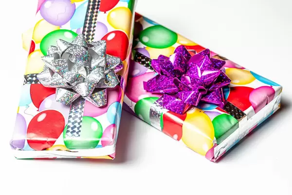 Two birthday gift boxes on white background (Flip 2020)