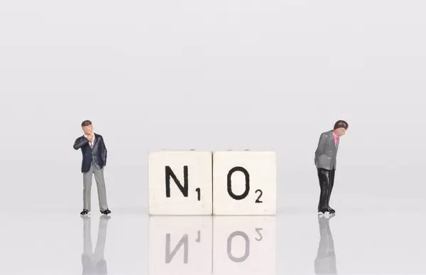 Two businessman standing next to no text on wooden blocks