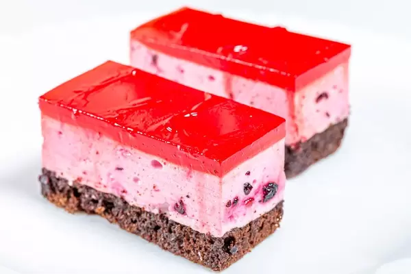 Two cakes with chocolate biscuit, berry souffle and red marmalade (Flip 2019)