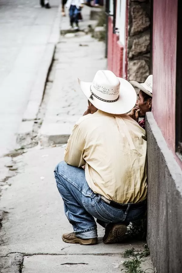 Two Cowboys Talking in the Street