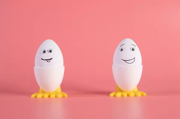 Two Easter eggs on pink background