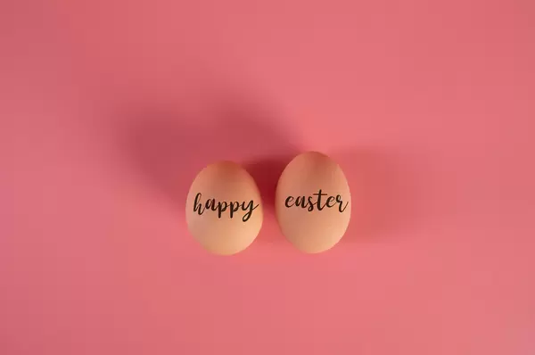 Two eggs with Happy Easter text