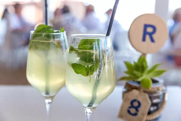 Two glasses of Hugo: light alcoholic cocktail made with Prosecco and served with fresh mint