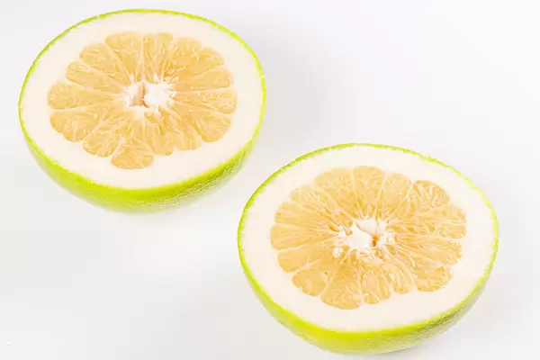 Two halves of fresh ripe sweetie fruit