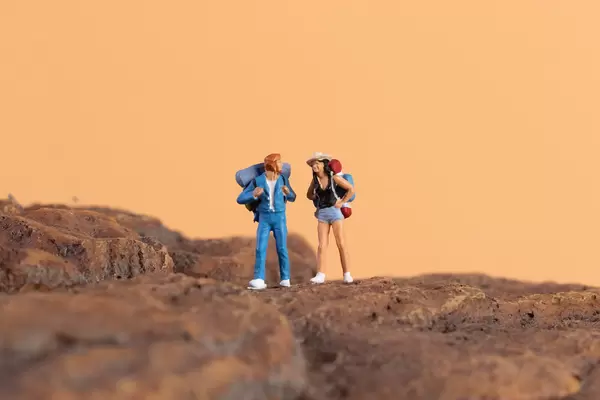 Two hikers standing on rocks