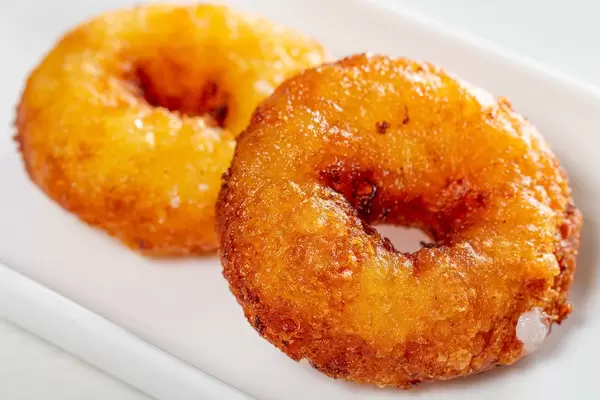 Two homemade fried donuts on a white plate (Flip 2019)
