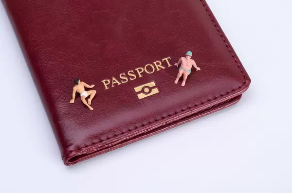 Two men sitting on top of the passport