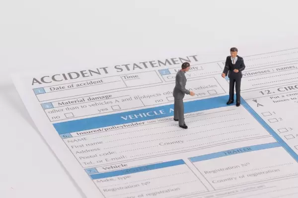 Two men with accident statement report