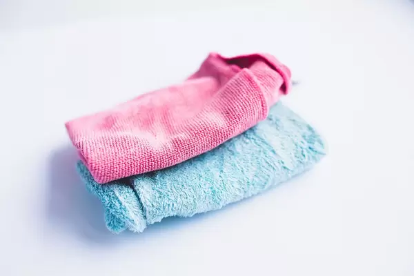 Two microfible cloths on white background