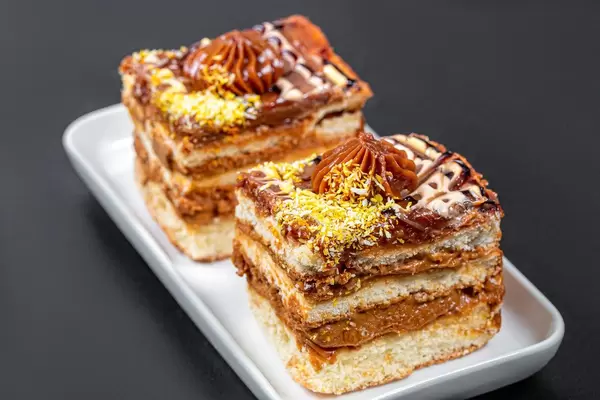 Two pieces of cake with condensed milk and coconut (Flip 2019)