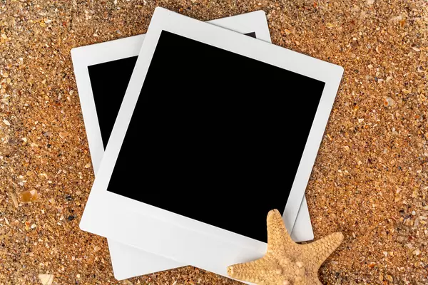Two polaroid photos with a starfish on the background of the sea coast, close-up