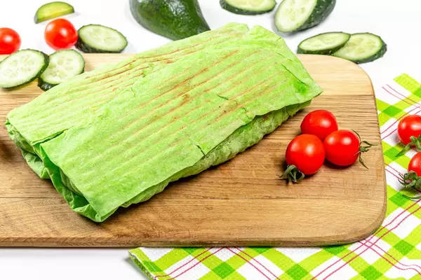 Two Shawarma in green pita bread with vegetables (Flip 2020)