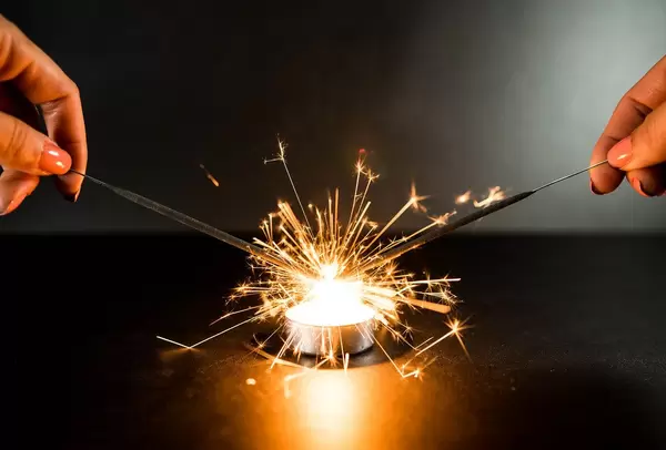 Two sparklers catching on fire