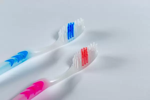 Two toothbrushes on white background
