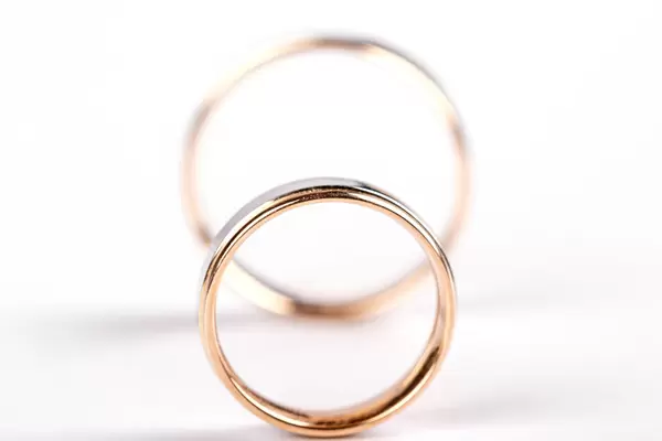 Two wedding rings on white