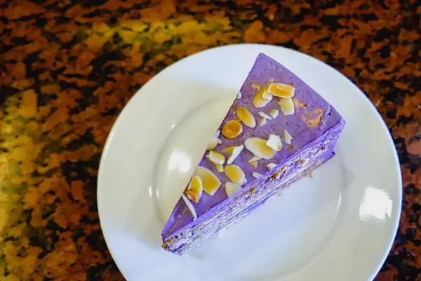 Ube cake with nuts on flat surface (Flip 2019)