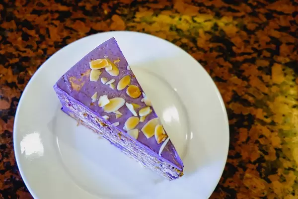 Ube cake with nuts on flat surface.jpg