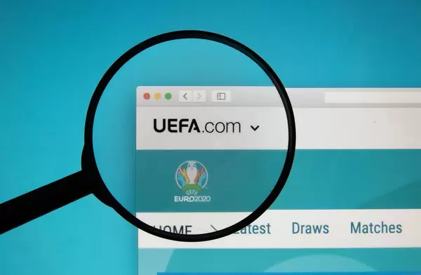 UEFA logo on a laptop screen with a magnifying glass
