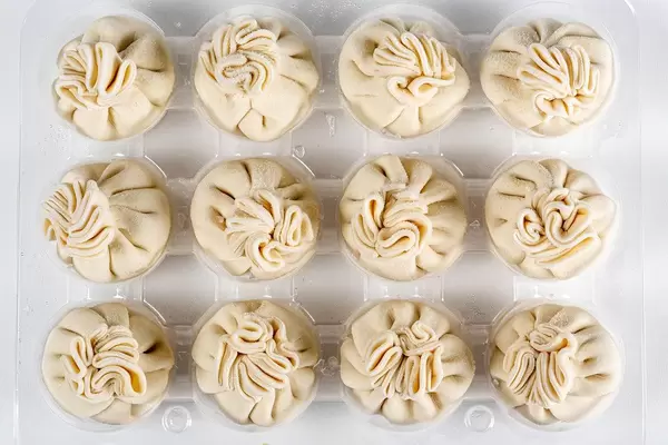 Uncooked khinkali, traditional Georgian cuisine, top view