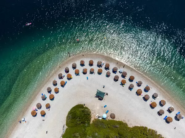 Uncrowded serviced beach in the high season on Alonnisos, Northern Sporades. Drone pic in summer 2021