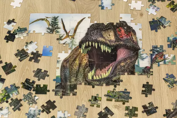Unfinished build puzzles with a dinosaur