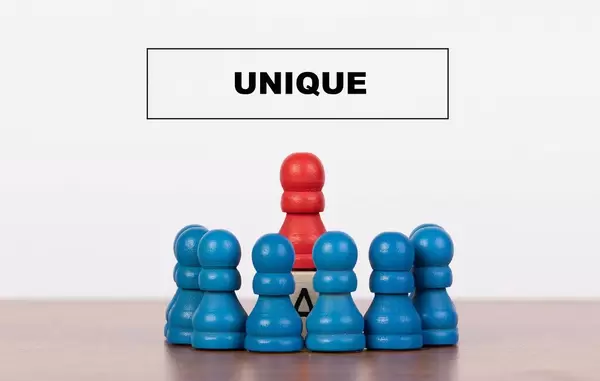 Unique concept with pawn figurines on table