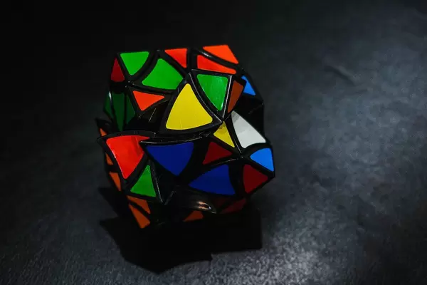 Unsolved curved tile cube in black surface