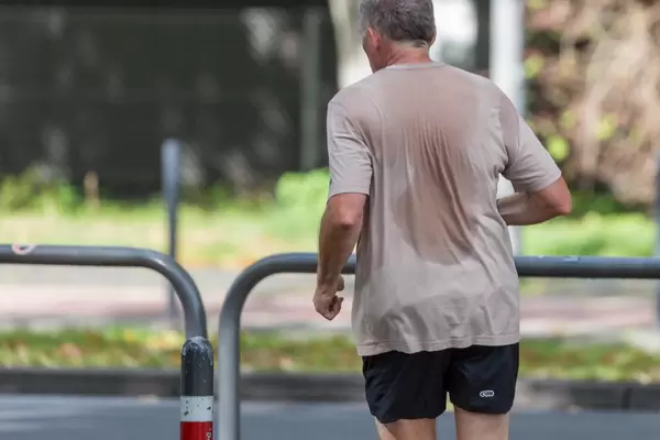Urban fitness: man goes jogging in Cologne, Germany