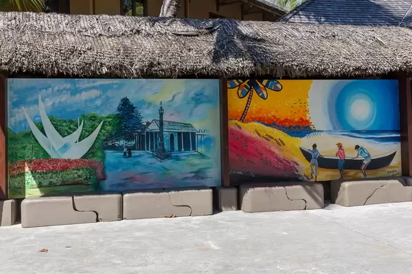 Urban street art shows painting of capital Victoria and beach of Seychelles Island Mahé