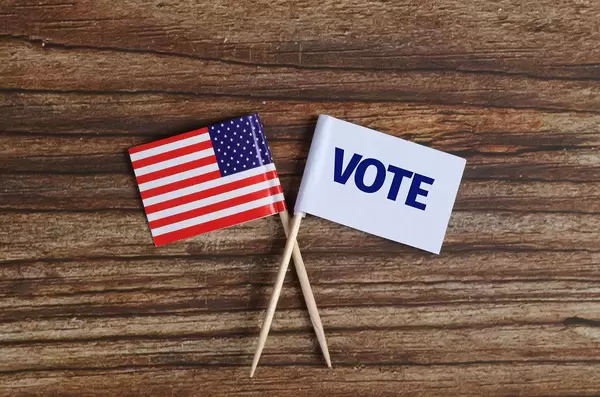 USA flag and white flag with vote text on white background