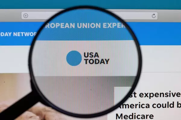 USA Today logo under magnifying glass