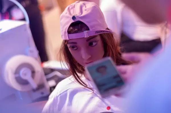 User controlling a Japanese sex doll via cell phone