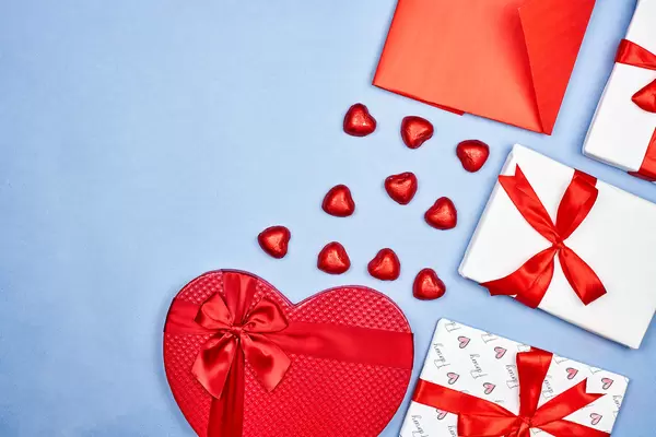 Valentine's day flat lay with gift boxes and sweet candies