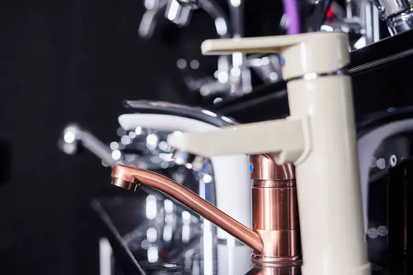 Variety of faucets in plumbing shop. Selective focus