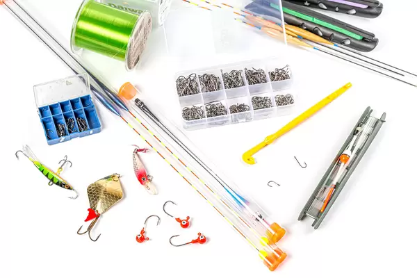 Various fisherman's equipment on white background