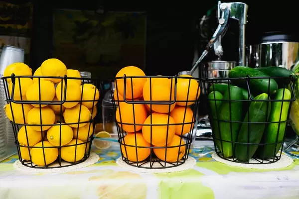 Various fruits inside metal baskets