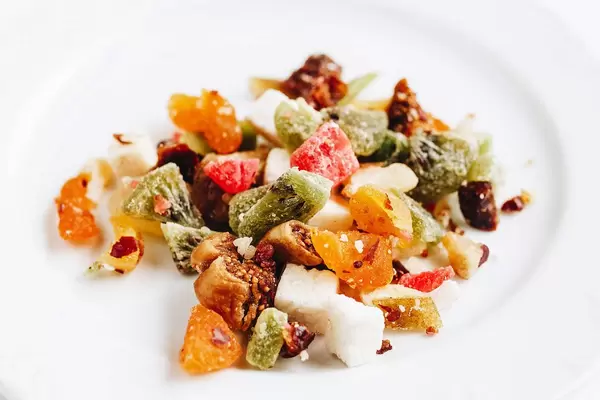 Various kinds of dry citrus fruits on white background