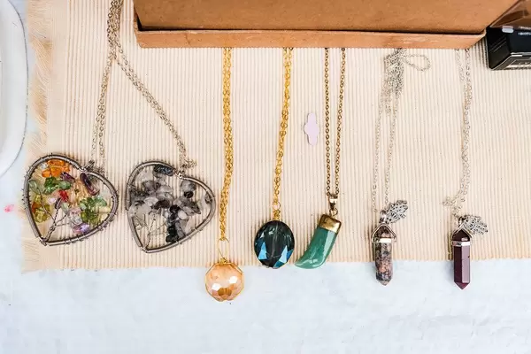 Various necklaces on white surface (Flip 2019)